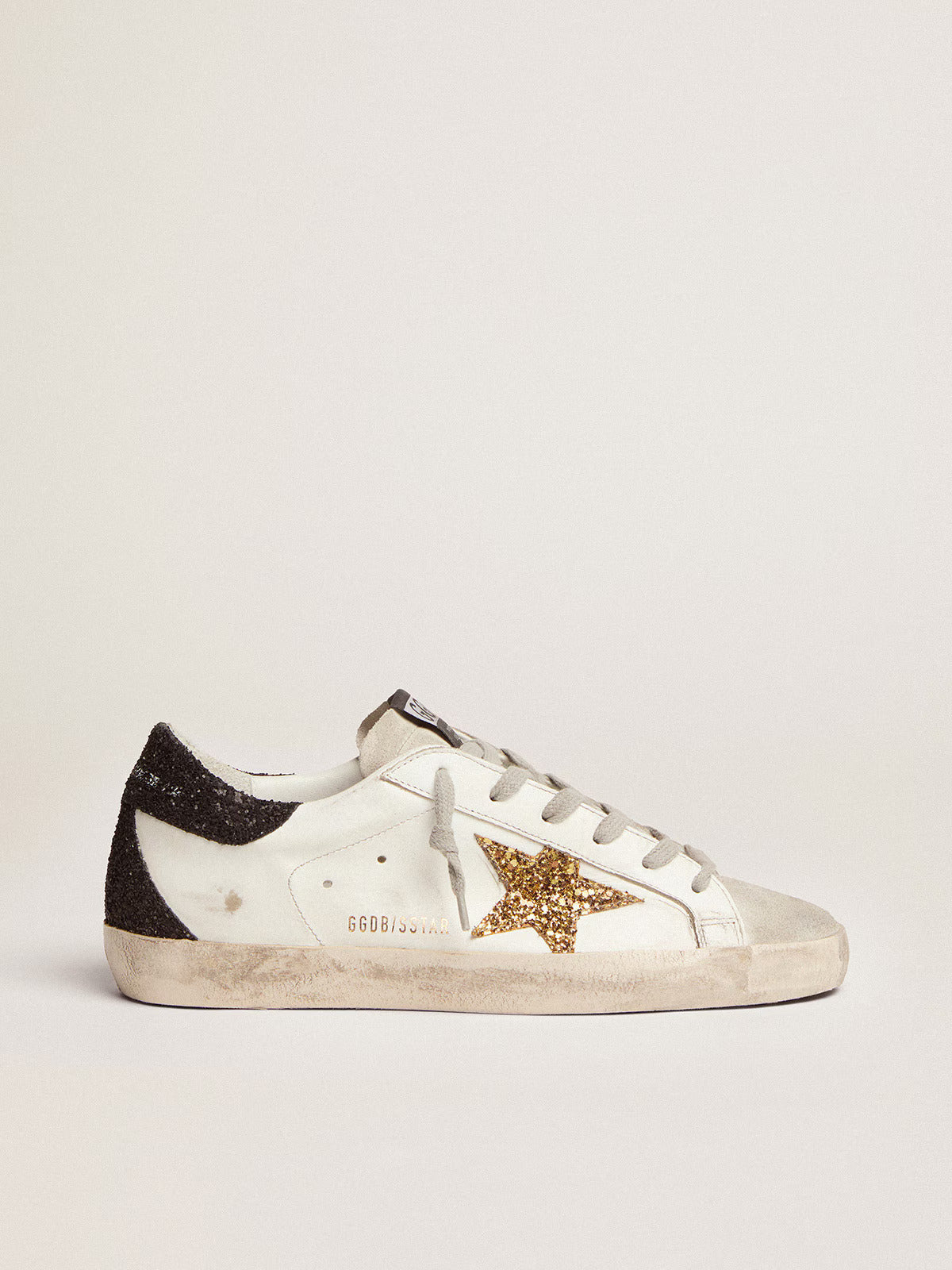 Super-Star LTD femme avec étoile dorée et contrefort à paillettes noires